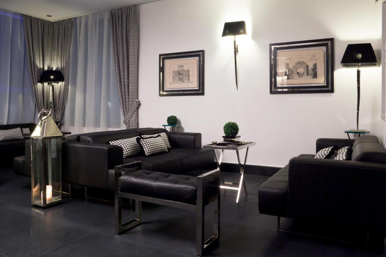 Lhp Napoli Palace & Spa Exterior photo A living room with a black floor